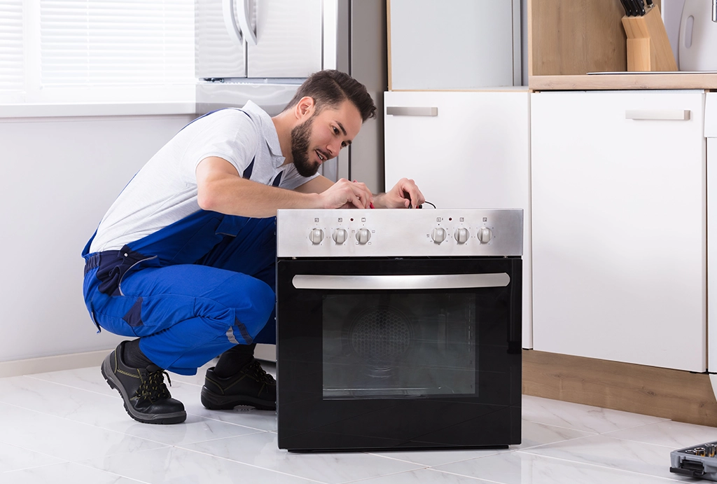 Man repairing oven